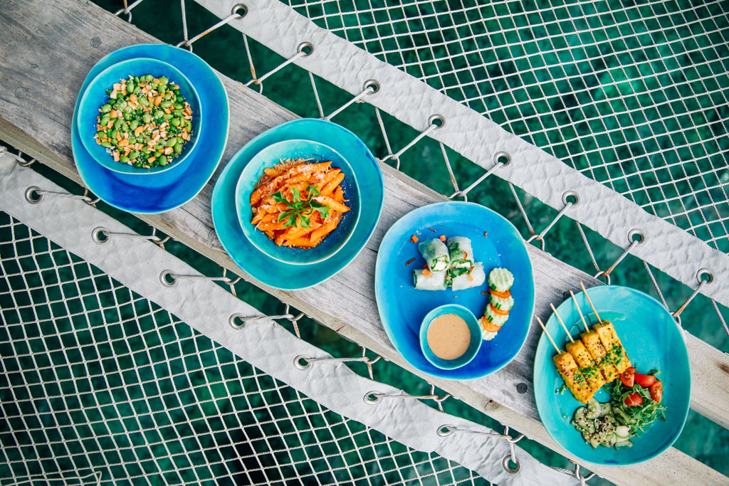 Soneva Fushi Out of the Blue set of plates with food on