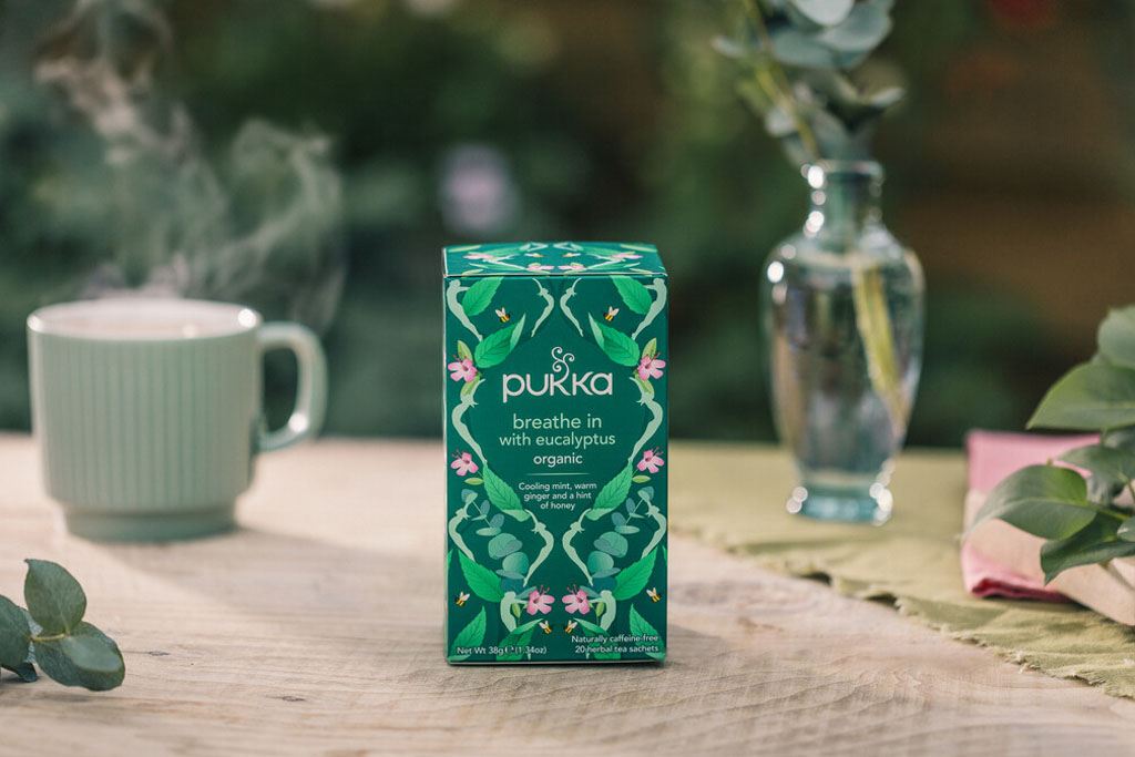 pukka tea green packet of the breathe in summer focus launch, sitting on tablle