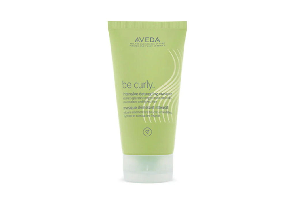 Green hair masque bottle with Aveda logo and product description on the front in dark grey text