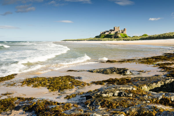 Bamburgh Castle taken here from the north beach dates back to the 6/7th century