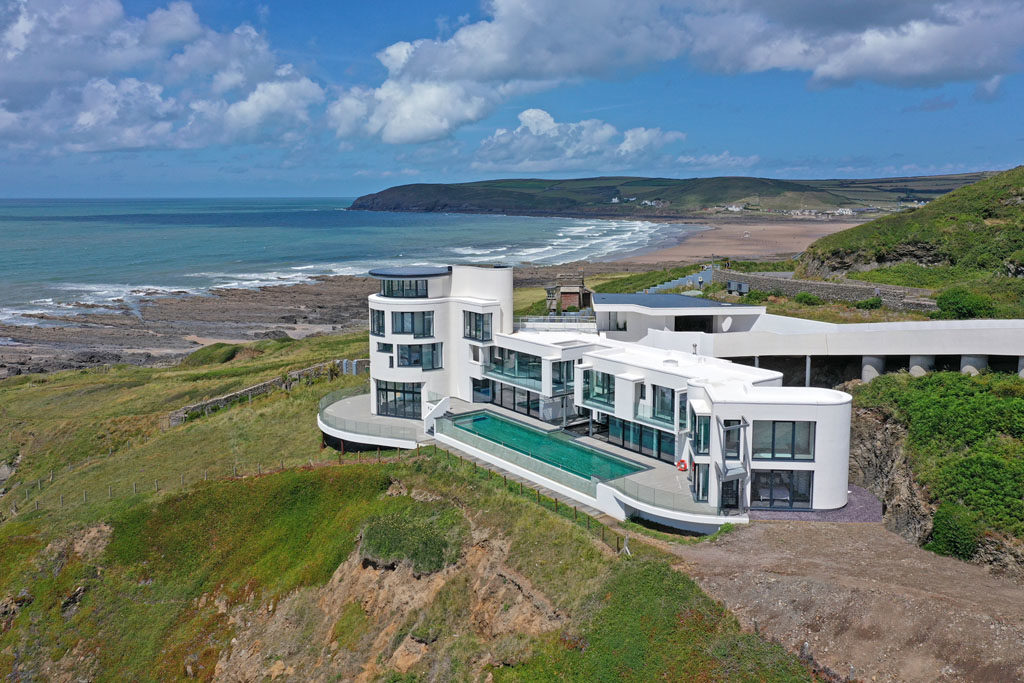 white modern grand designs home on chesil cliff overlooking coast in devon