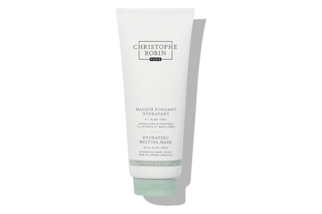 White tube bottle of hair product with Christophe Robin logo and product details on front in black text