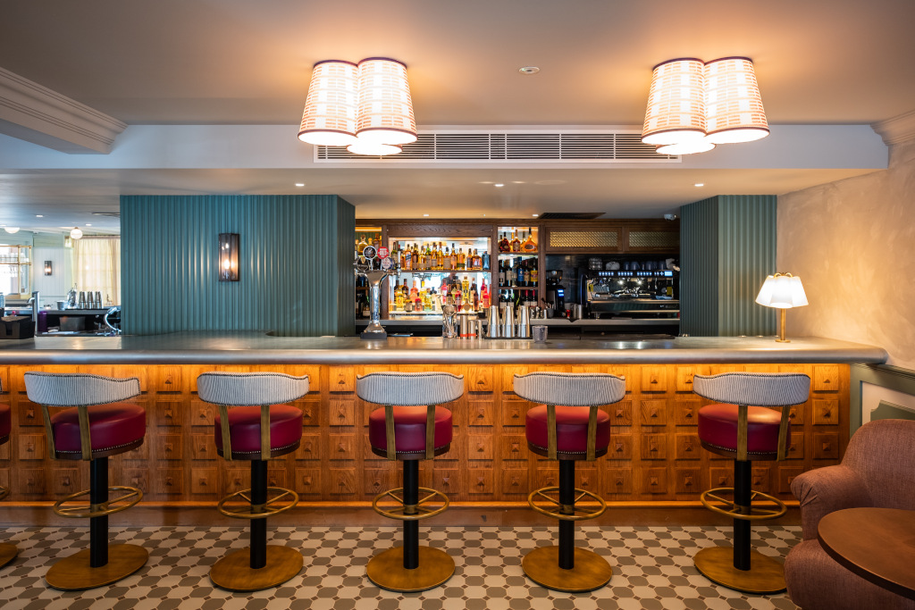 bar with bar stools and contemporary bright interior at the georgian coppa club haslemere 