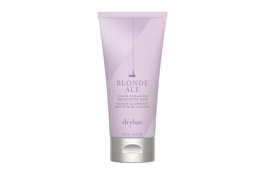 Purple tube bottle of hair product with Drybar logo and product details on front in black text