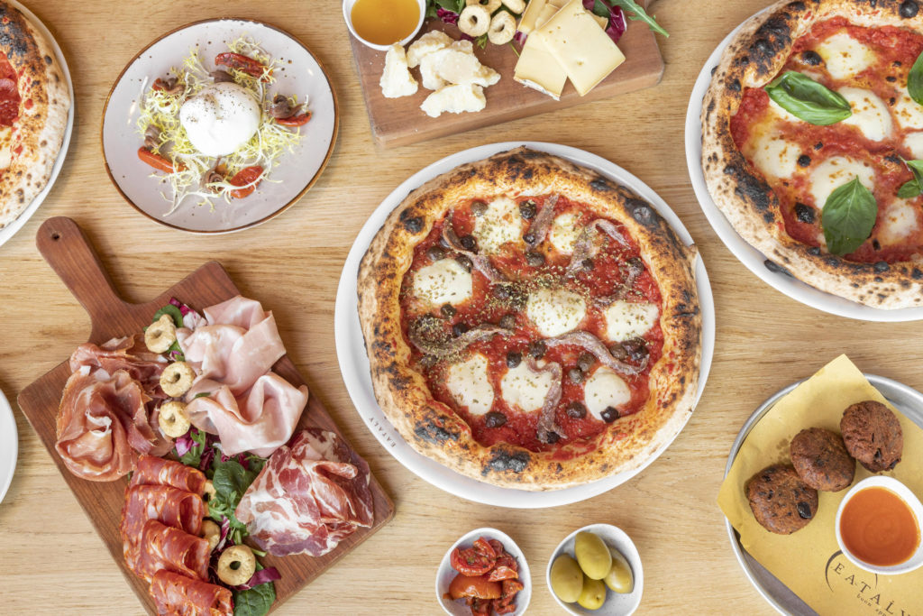 an array of plates of food from Pasta e Pizza in Eataly