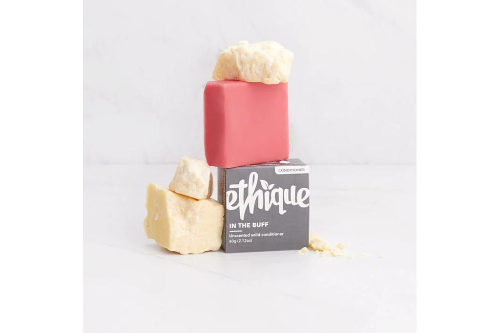 Pink conditioner bar on top of packaging