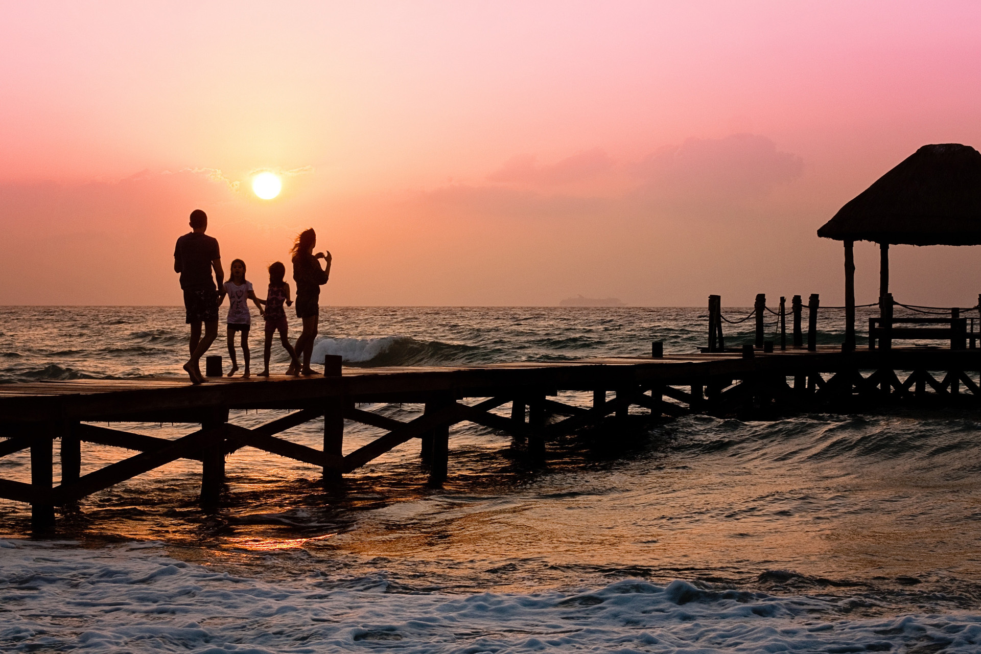 A family silhouette against the sunset