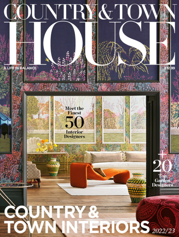 Country & Town Interiors 2022/23 issue cover featureing floral patterned walls and a warm toned living room