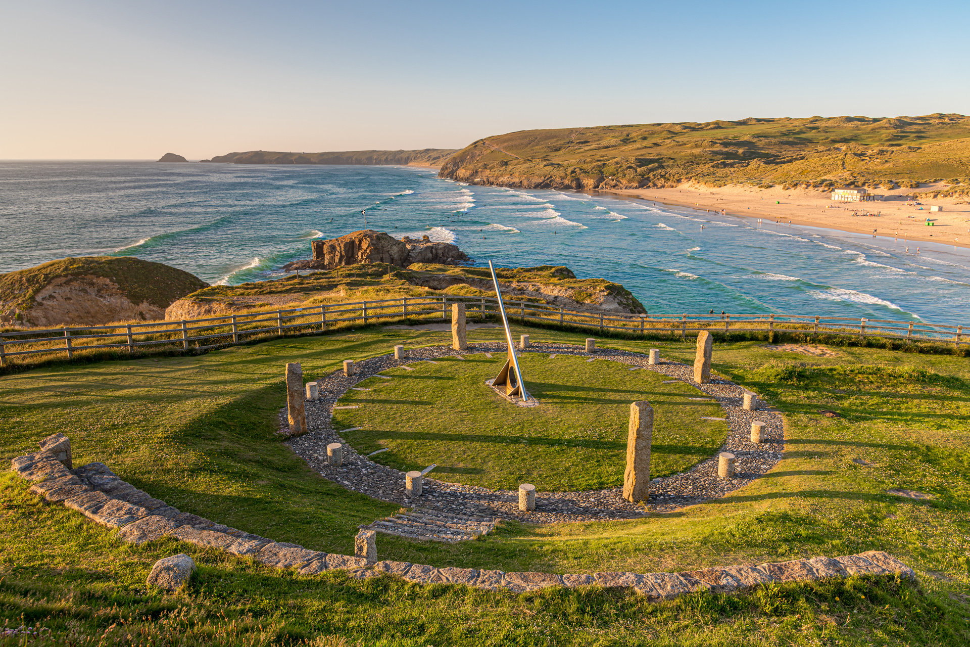 A view of Perranporth, Cornwall with the sun dial in the foreground and the beach behind
