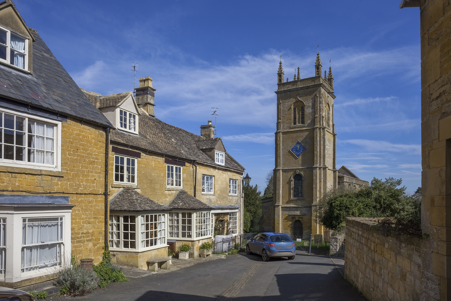 Blockley village church with cottages alongside