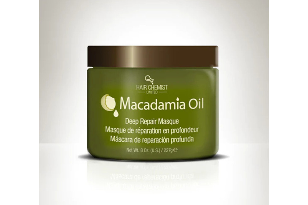 Green tub with Hair Chemist and product description on front in gold text, set against bronze shadow background