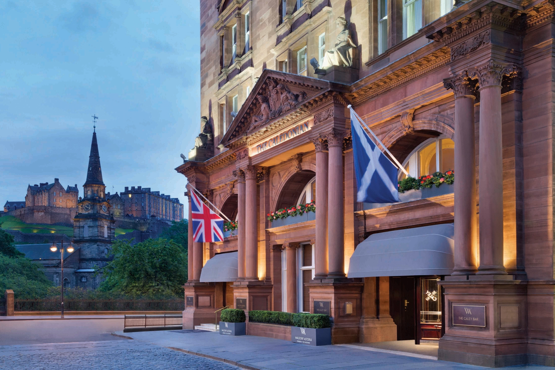The exterior of Waldorf Astoria Edinburgh, The Caledonian with Edinburgh Castle in the background