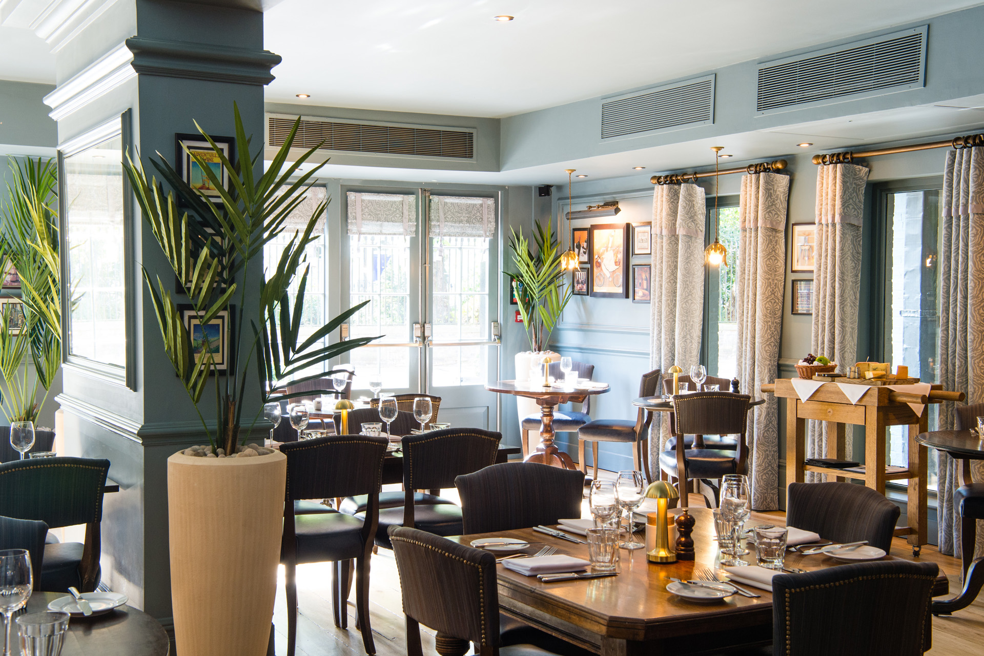 A restaurant with laid tables ready for service