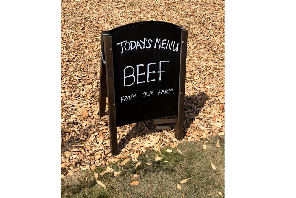 Sign saying 'Today's menu: Beef' at Diddly Squat restaurant