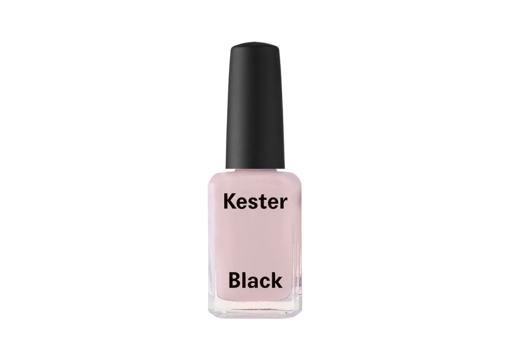 Bottle of light pink nail varnish with black cap