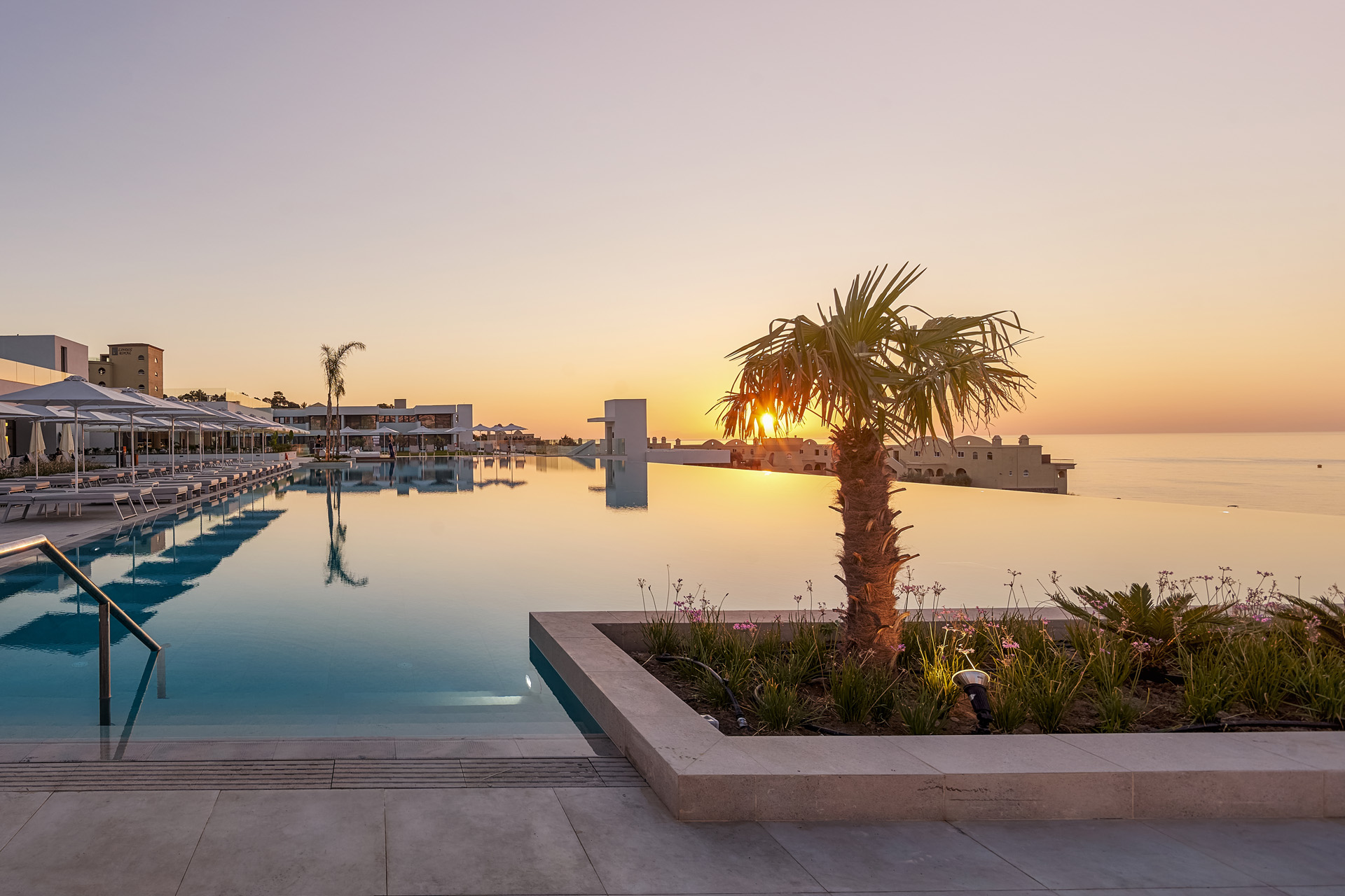 An infinity pool overlooking the sea at dusk