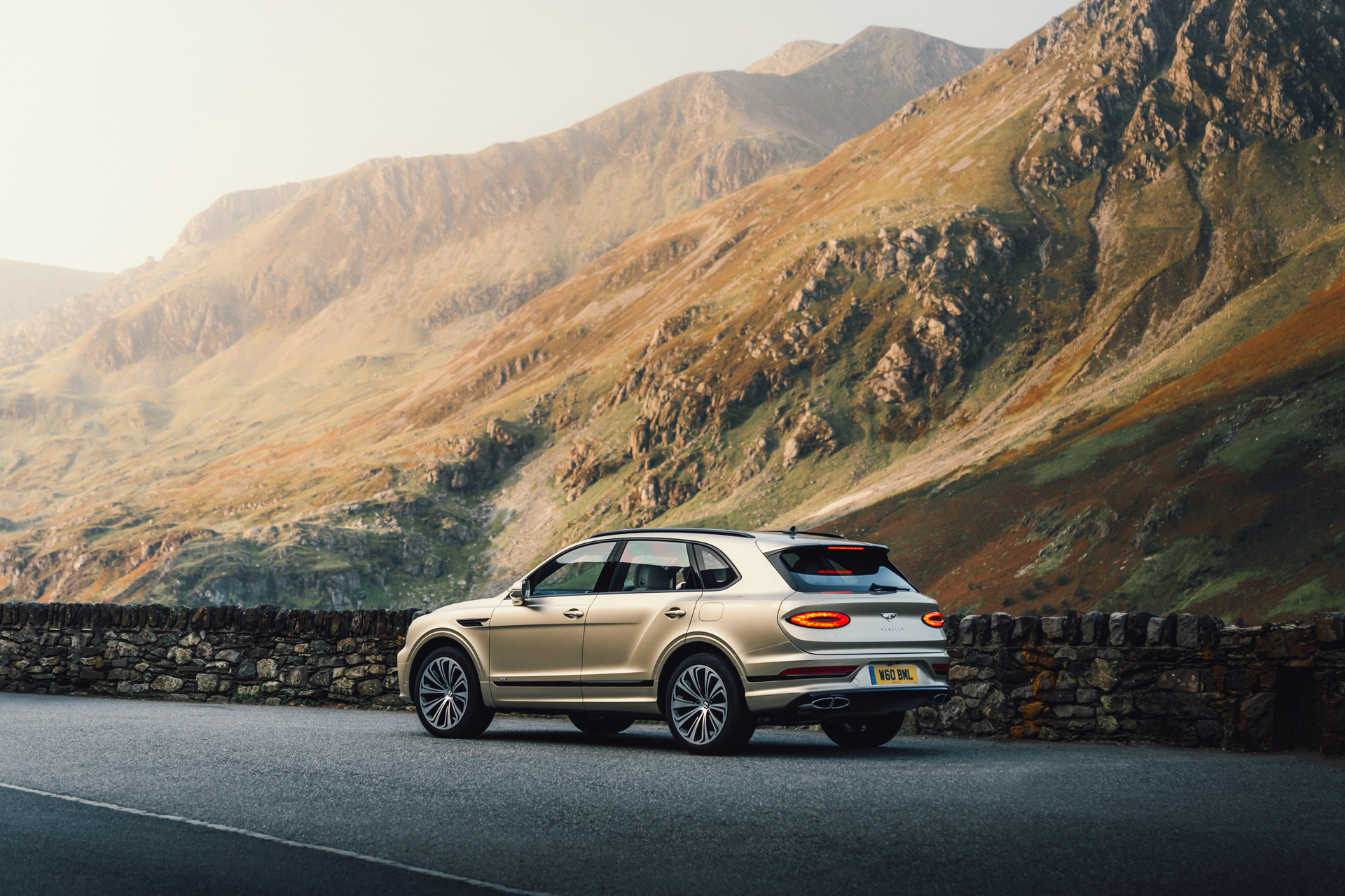 The New Bentayga Hybrid with a countryside landscape background