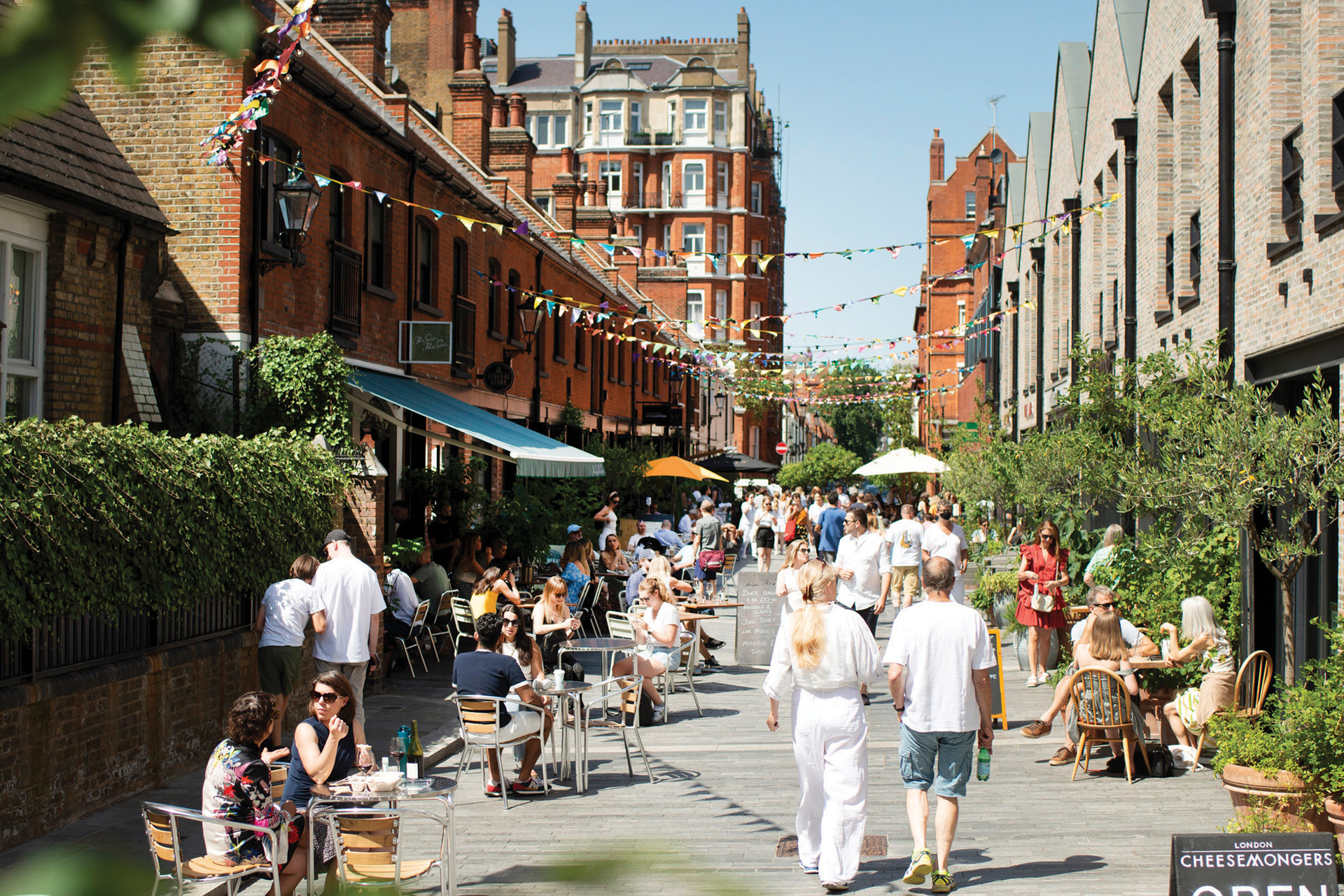 People walking down Pavilion Road in the sun