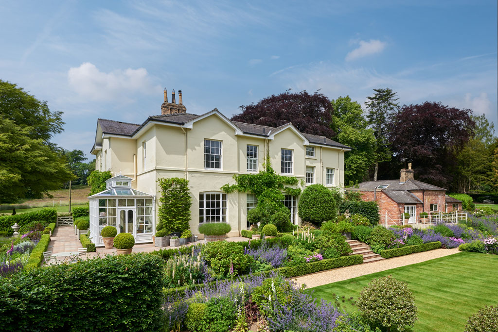exterior shot of a wisteria clad cream country home in Shropshire
