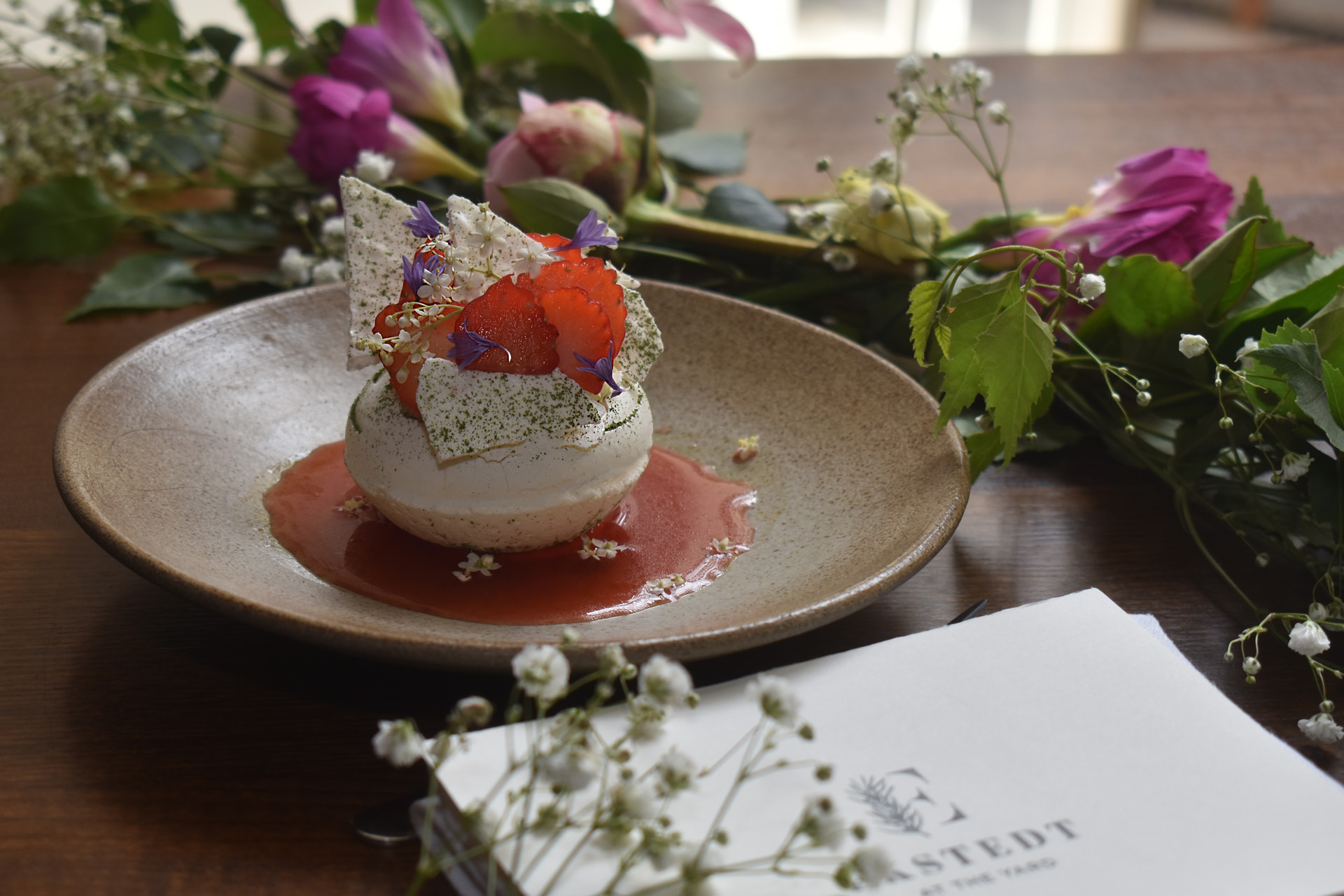 a menu surrounded by flowers