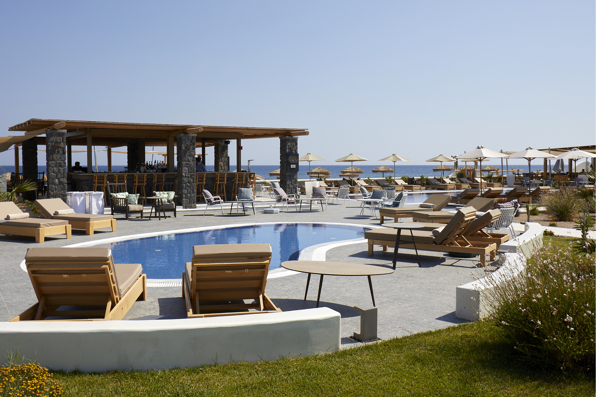 A swimming pool overlooking the sea at Sea Breeze Santorini