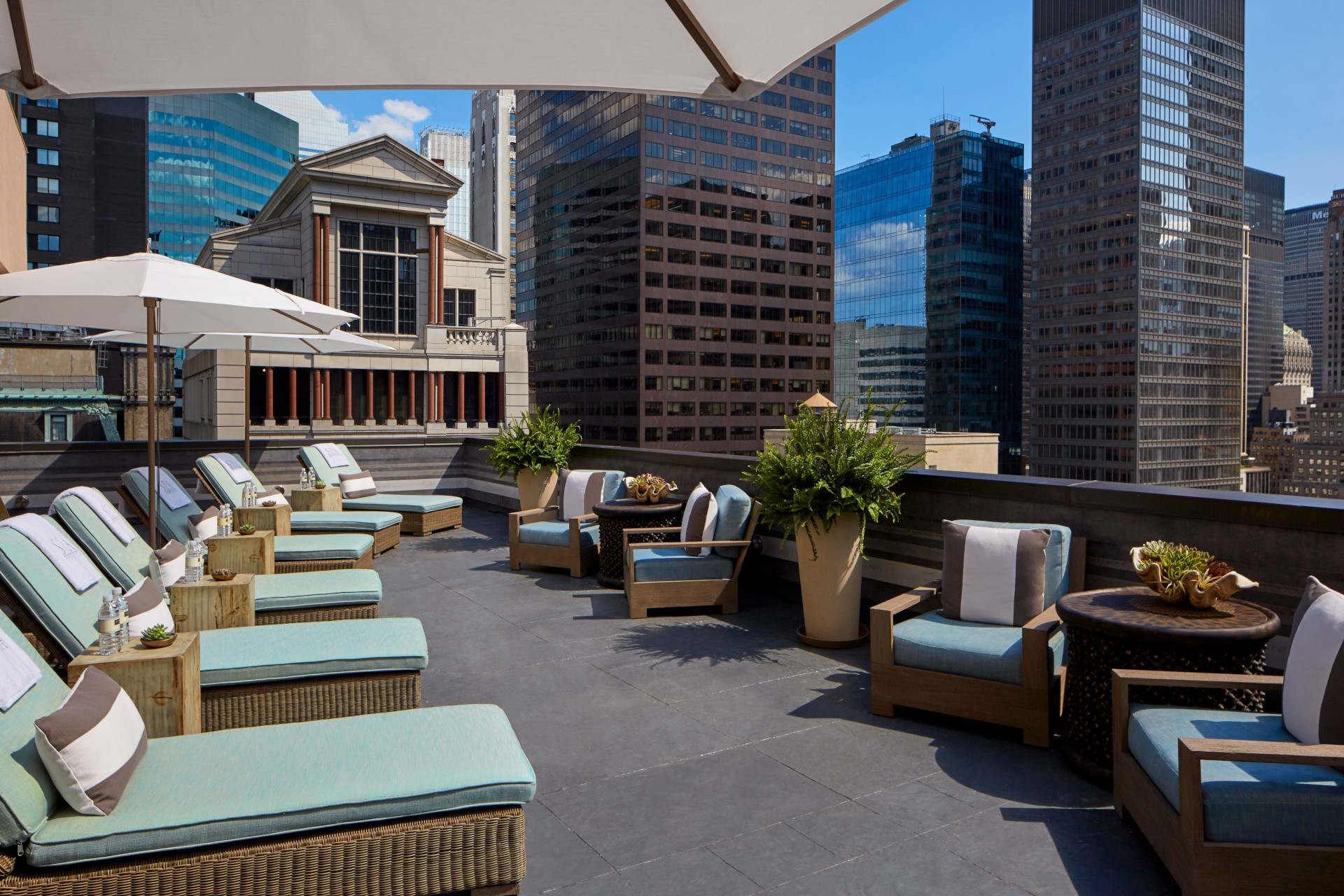 Sun terrace with loungers overlooking NYC