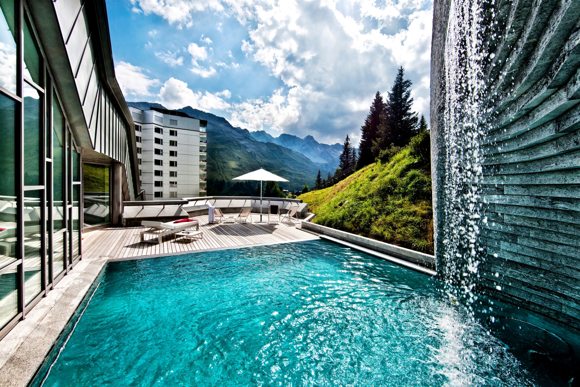 A swimming pool overlooking mountains in Switzerland