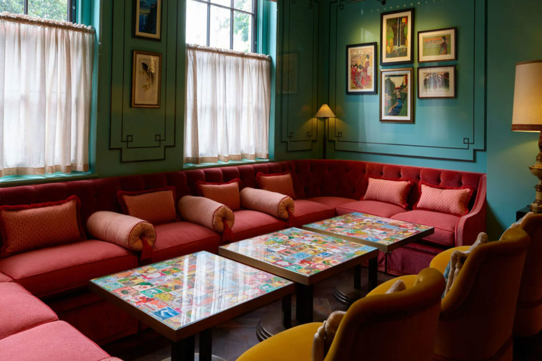 Interior of Beaverbrook Town House Restaurant with pink sofas and blue walls