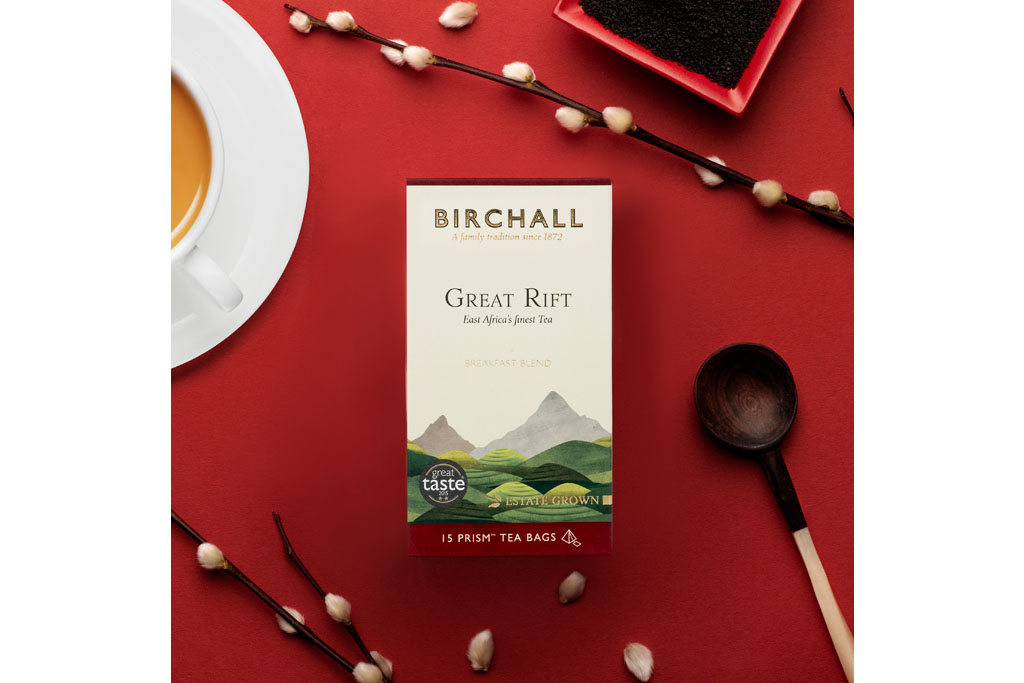 box of birchall tea on red table