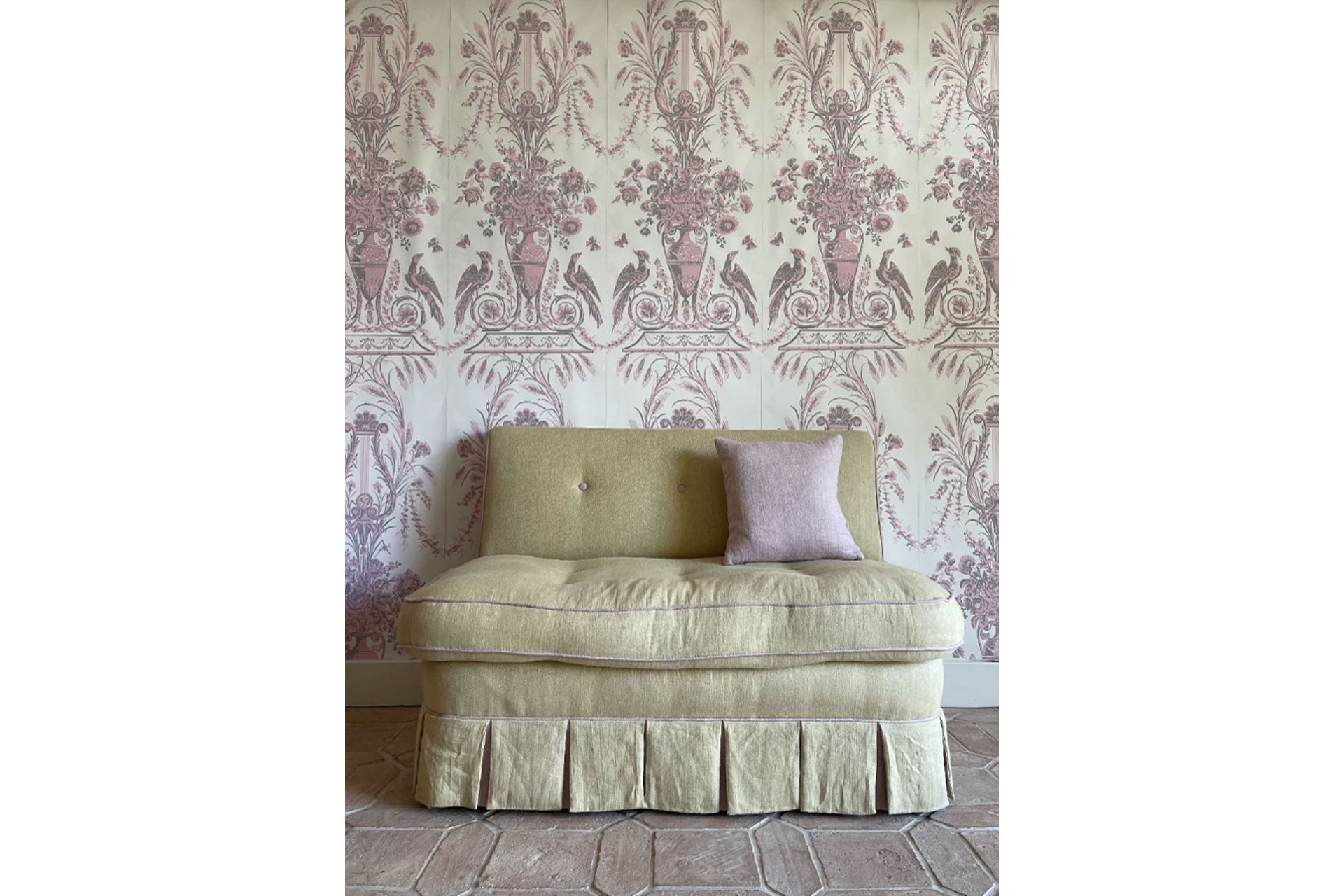 Jet by White Works Wallpaper with a vintage sofa in front