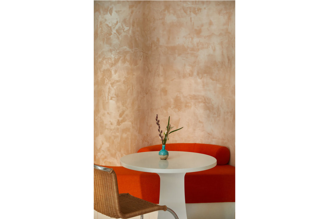 Close up of a table with a red sofa at Ottolenghi Chelsea