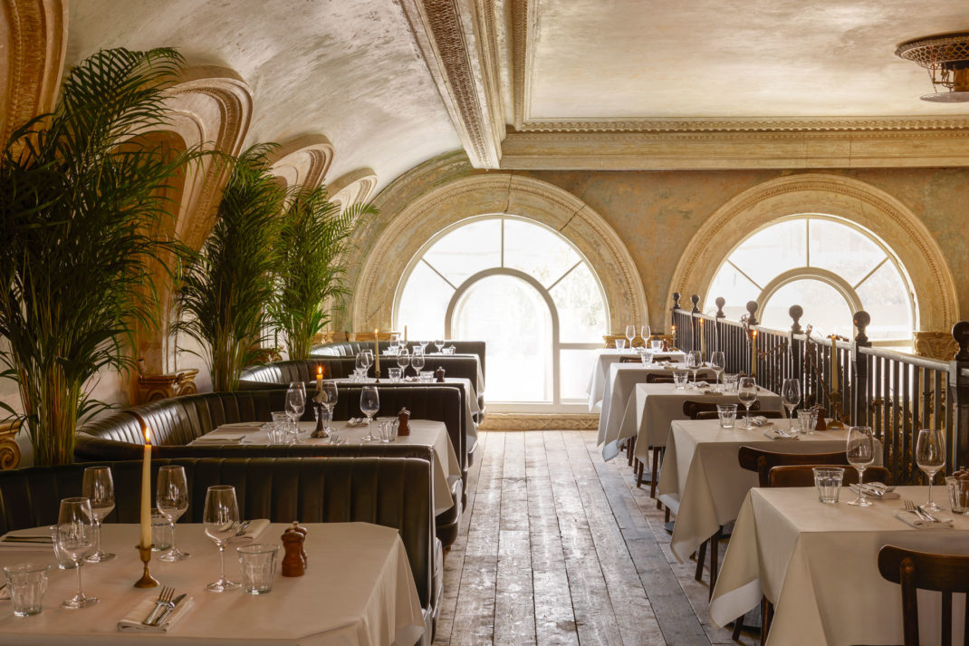 upstairs at the Sessions Art Club restaurant with plants and tables