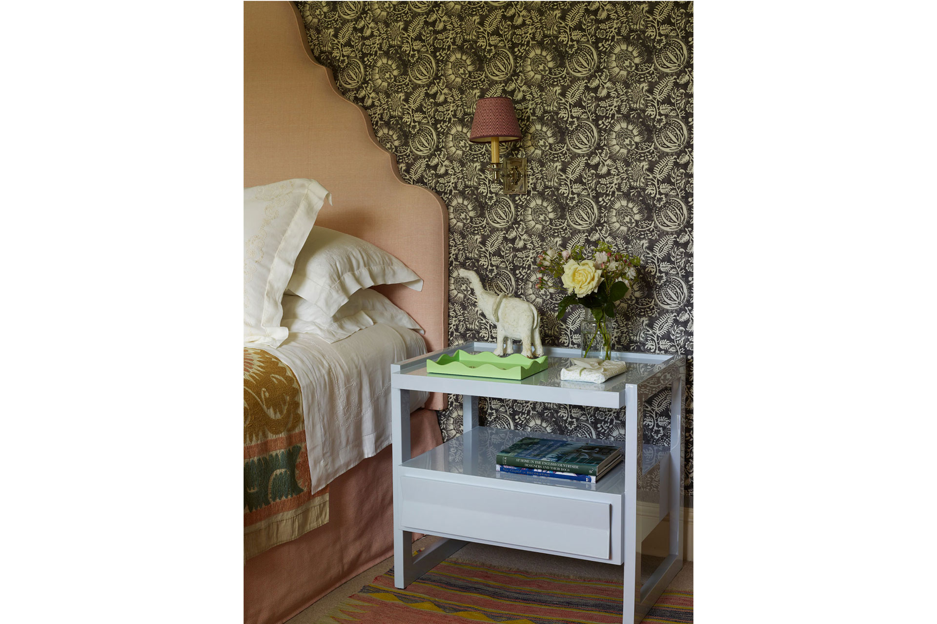a green tray stands on a blue coffee table in a spare bedroom