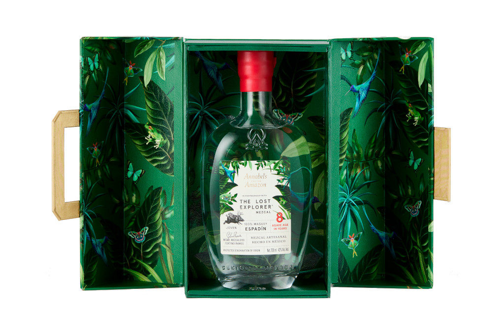 Green leafy gift box with bottle inside