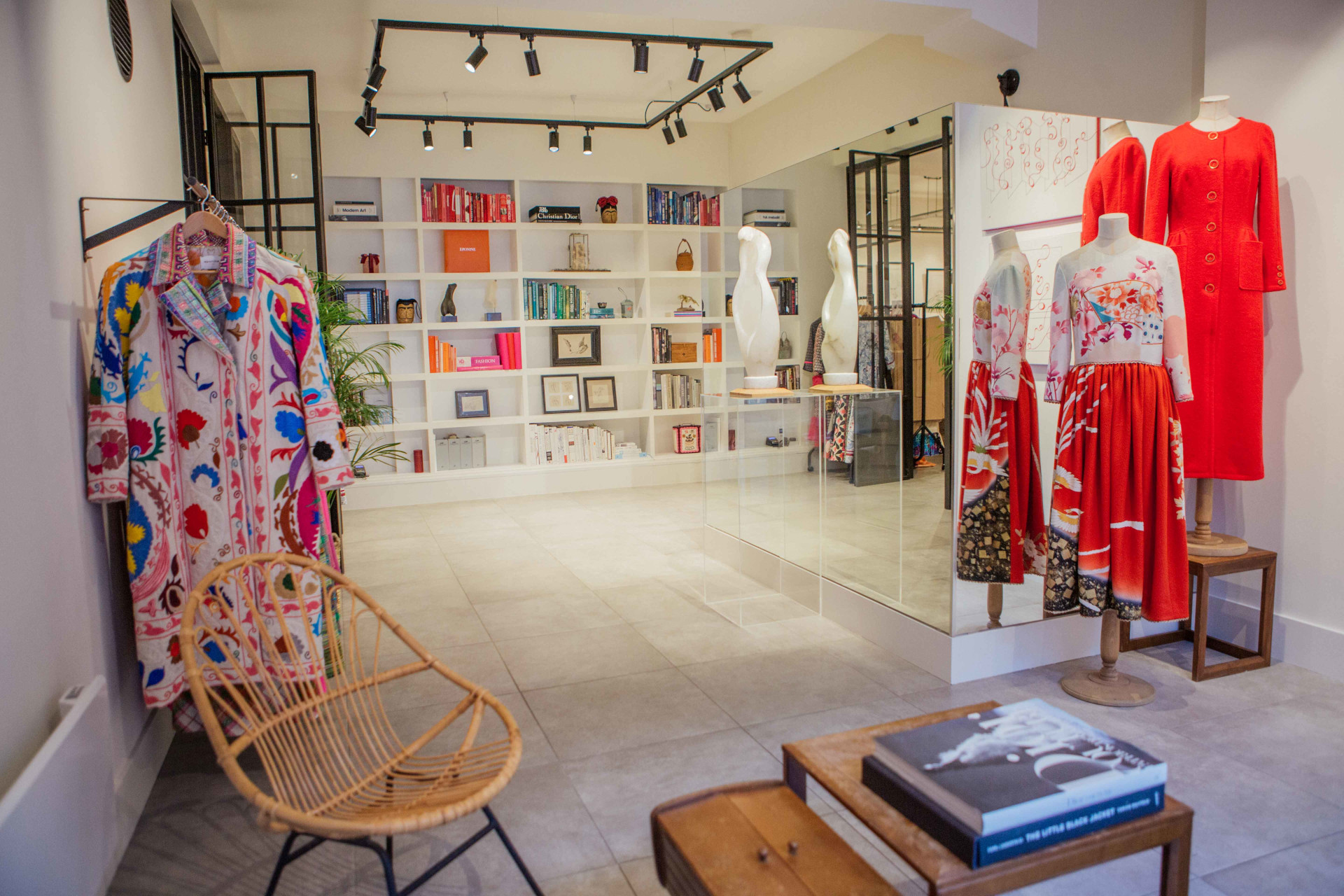 Shop interior with dresses and artworks