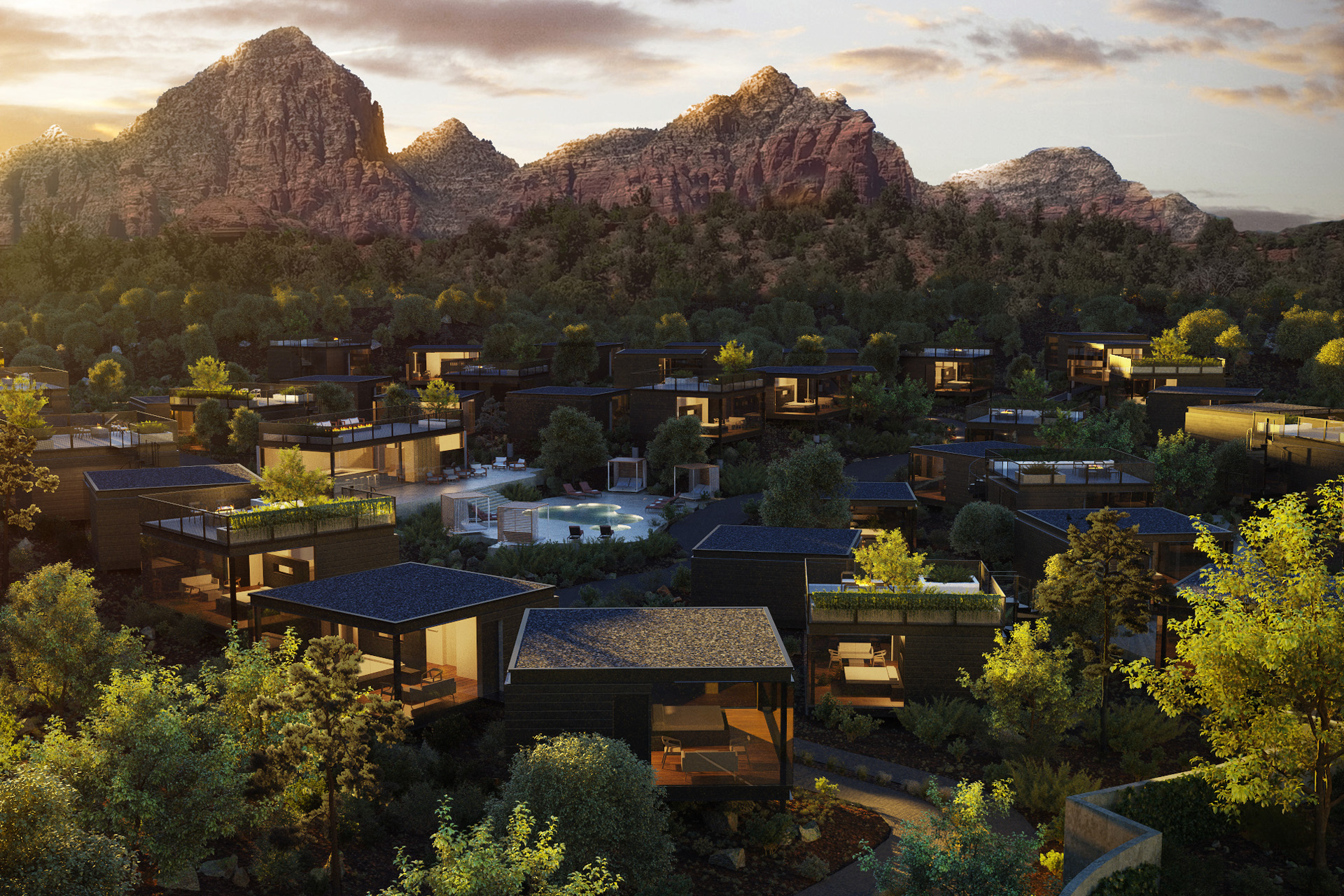 Red rocky mountains in the background with individual apartments in the foreground