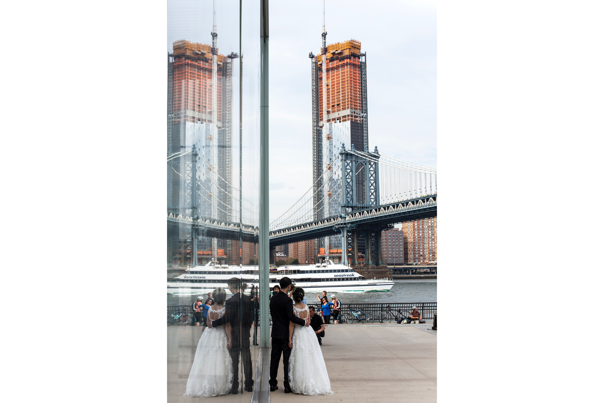 Newly married couple looking at Manhattan Bridge