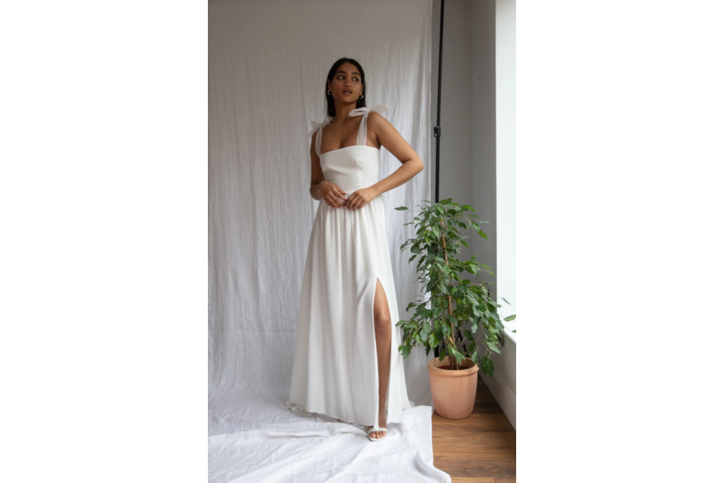 Model posing in wedding dress in studio