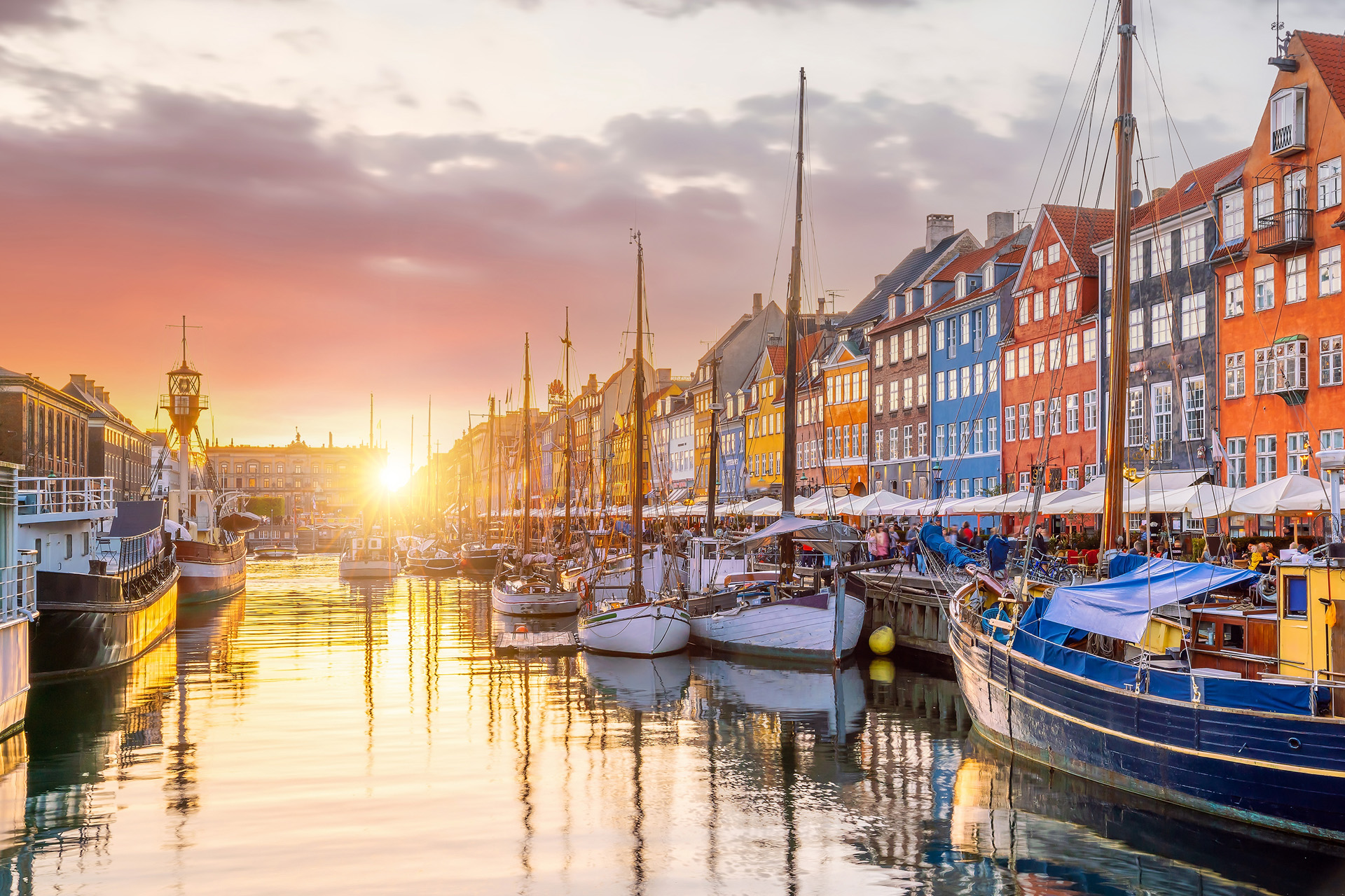 Cityscape of downtown Copenhagen city skyline in Denmark at famous old Nyhavn port at sunset