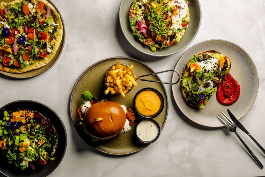 dishes of food layed ut on stone white tables