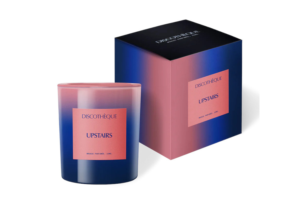 Blue and pink candle next to matching box