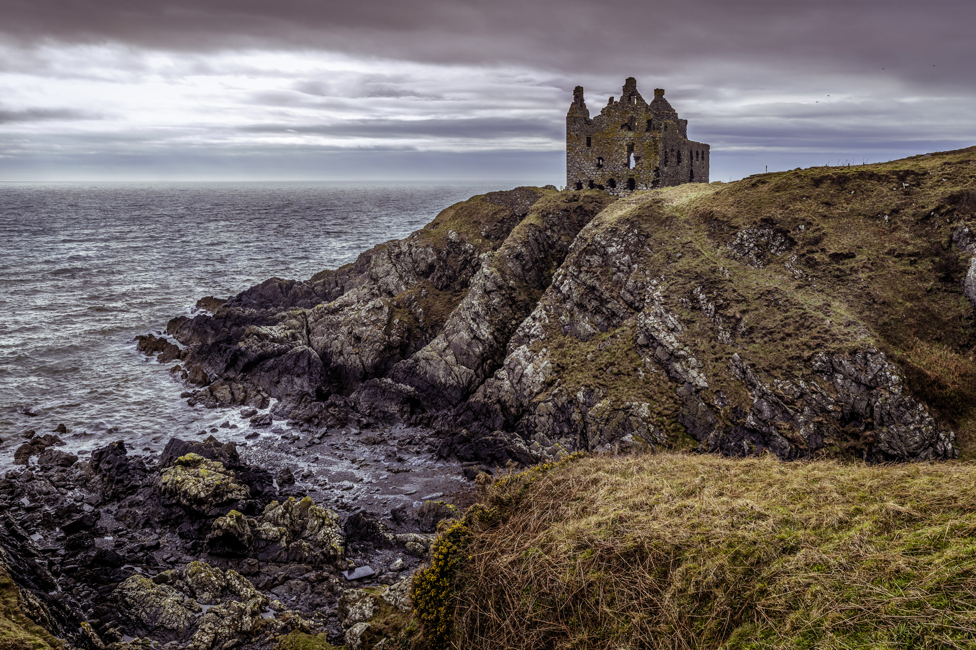 Dunskey Castle situated on cliff edge which protrudes into the sea, built in 12th Century. This is an iconioc landmark in Scotland sitated about half a mile from Portpatrick on the west coast.
