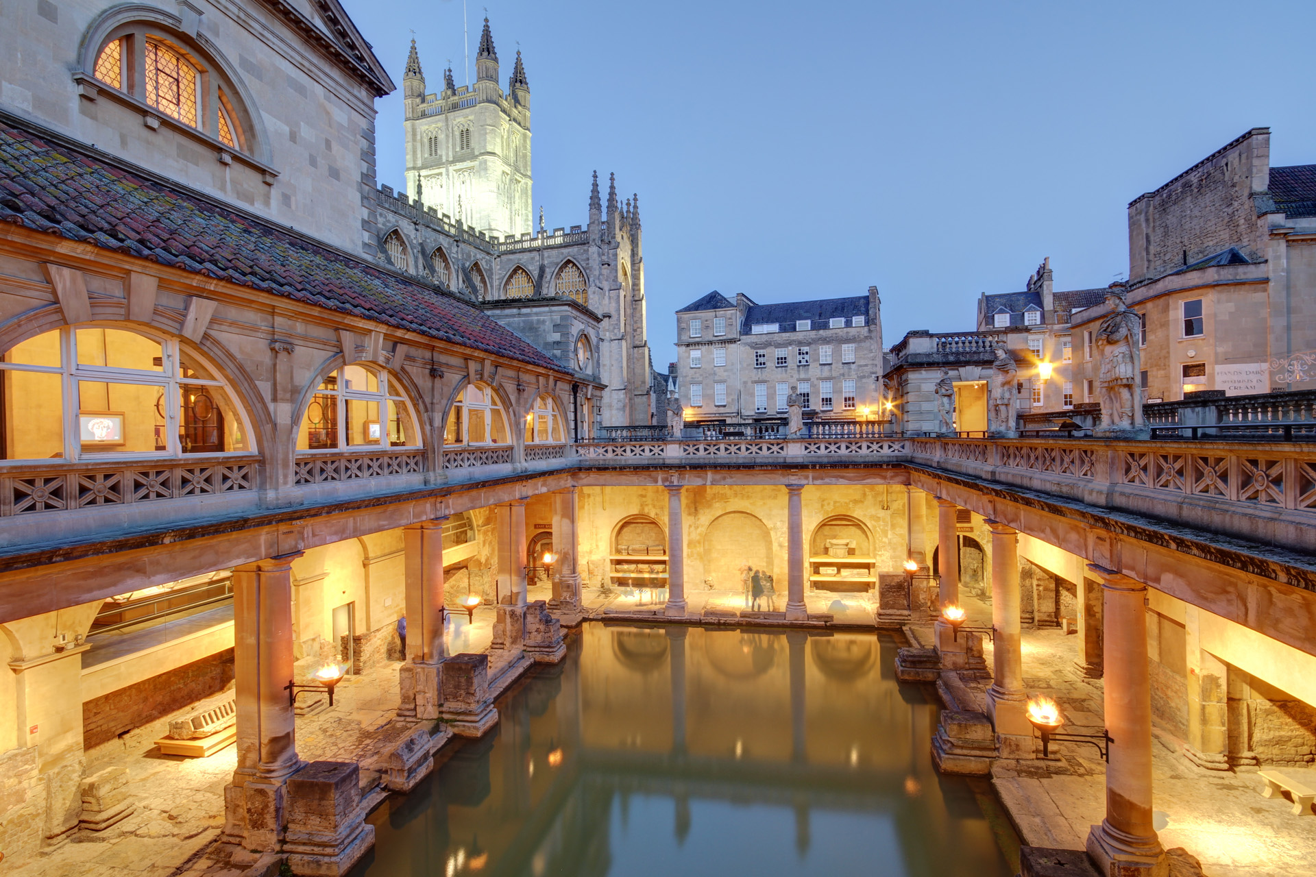 The Roman Baths lit up at dusk