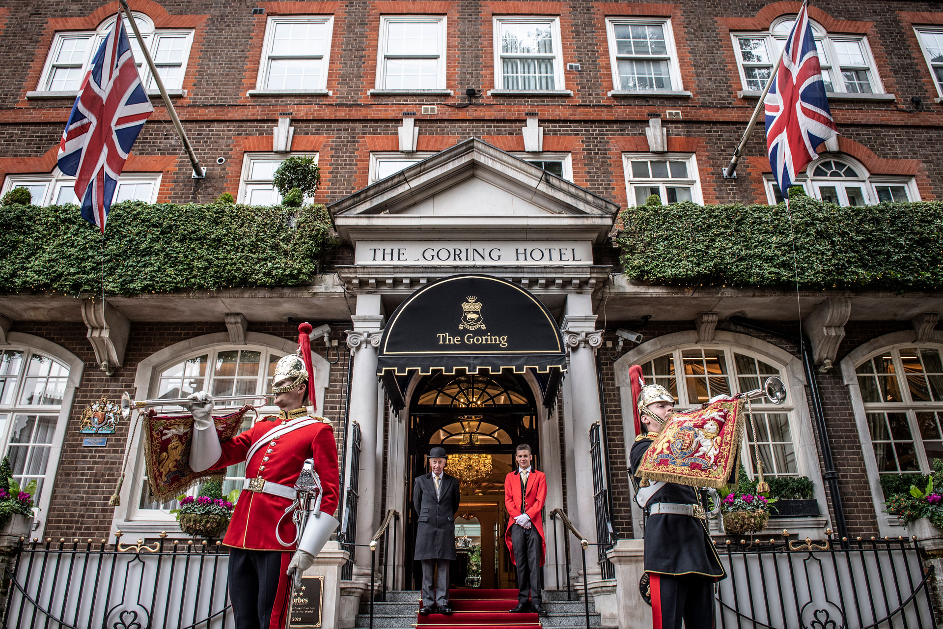 Guards standing outside of hotel enternce