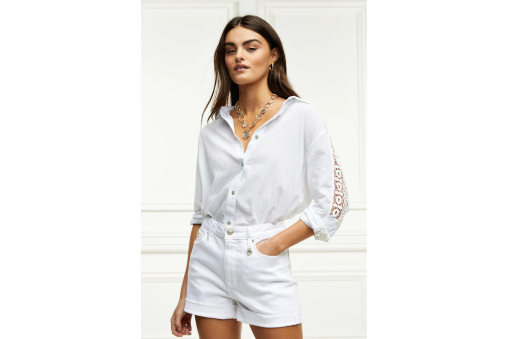 Woman in white shirt and shorts