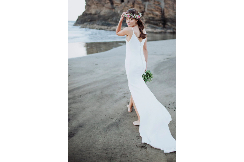 Model in white dress on the beach