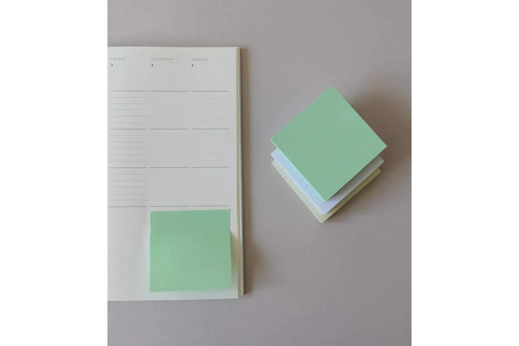 Sticky notes next to planner