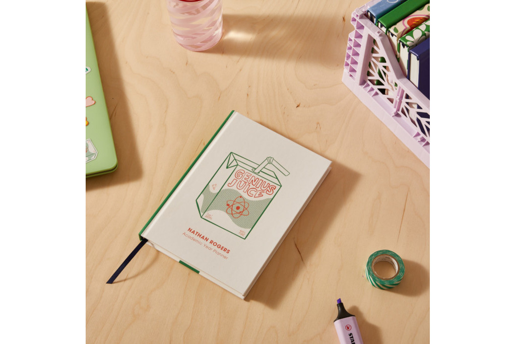 Diary with colourful cover on messy desk