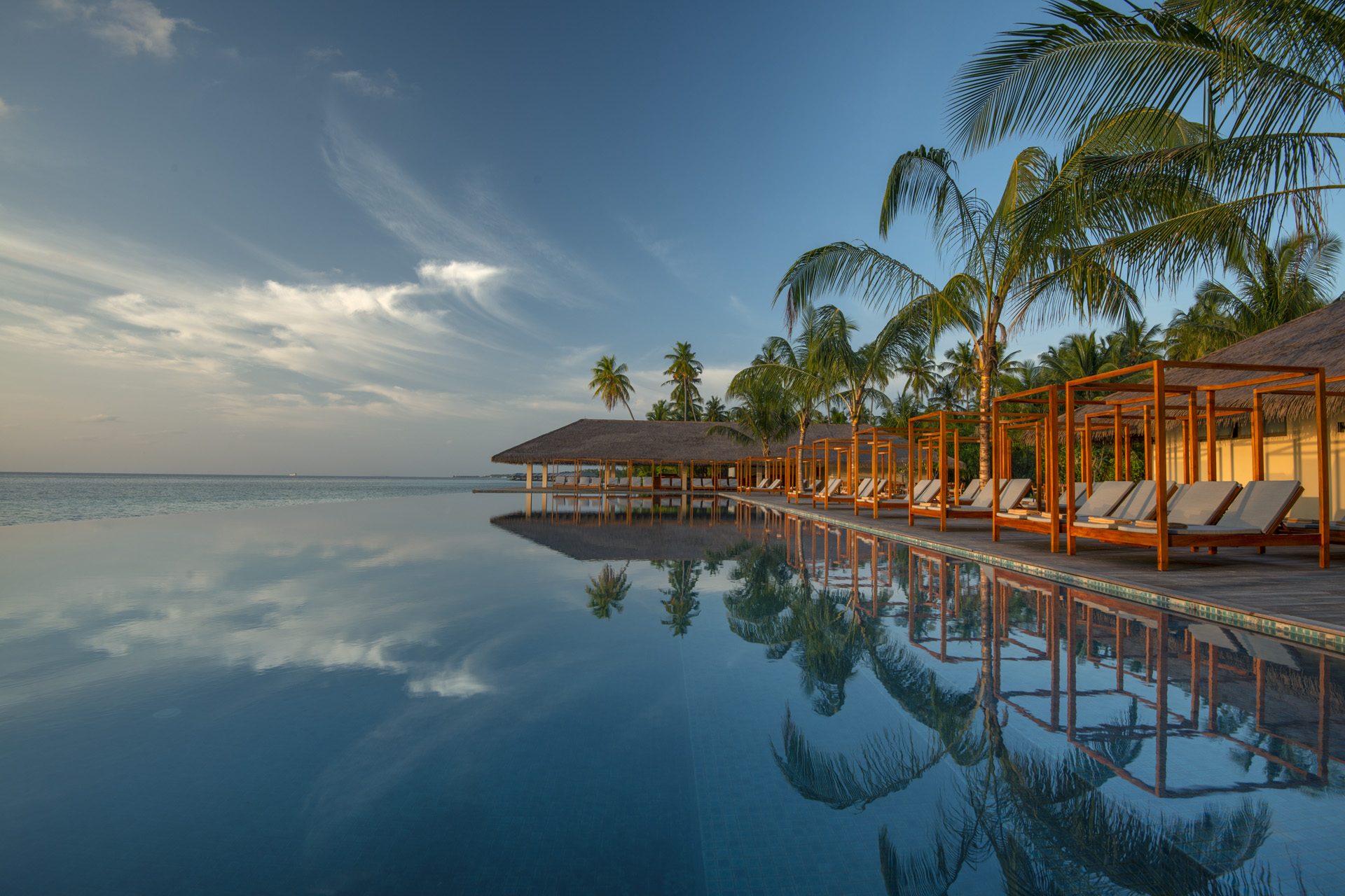 reflective water below sunbeds