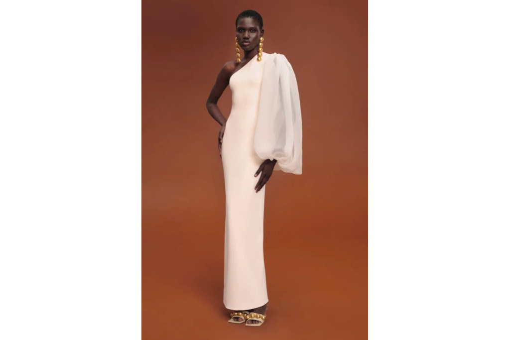 Woman in one shoulder white dress